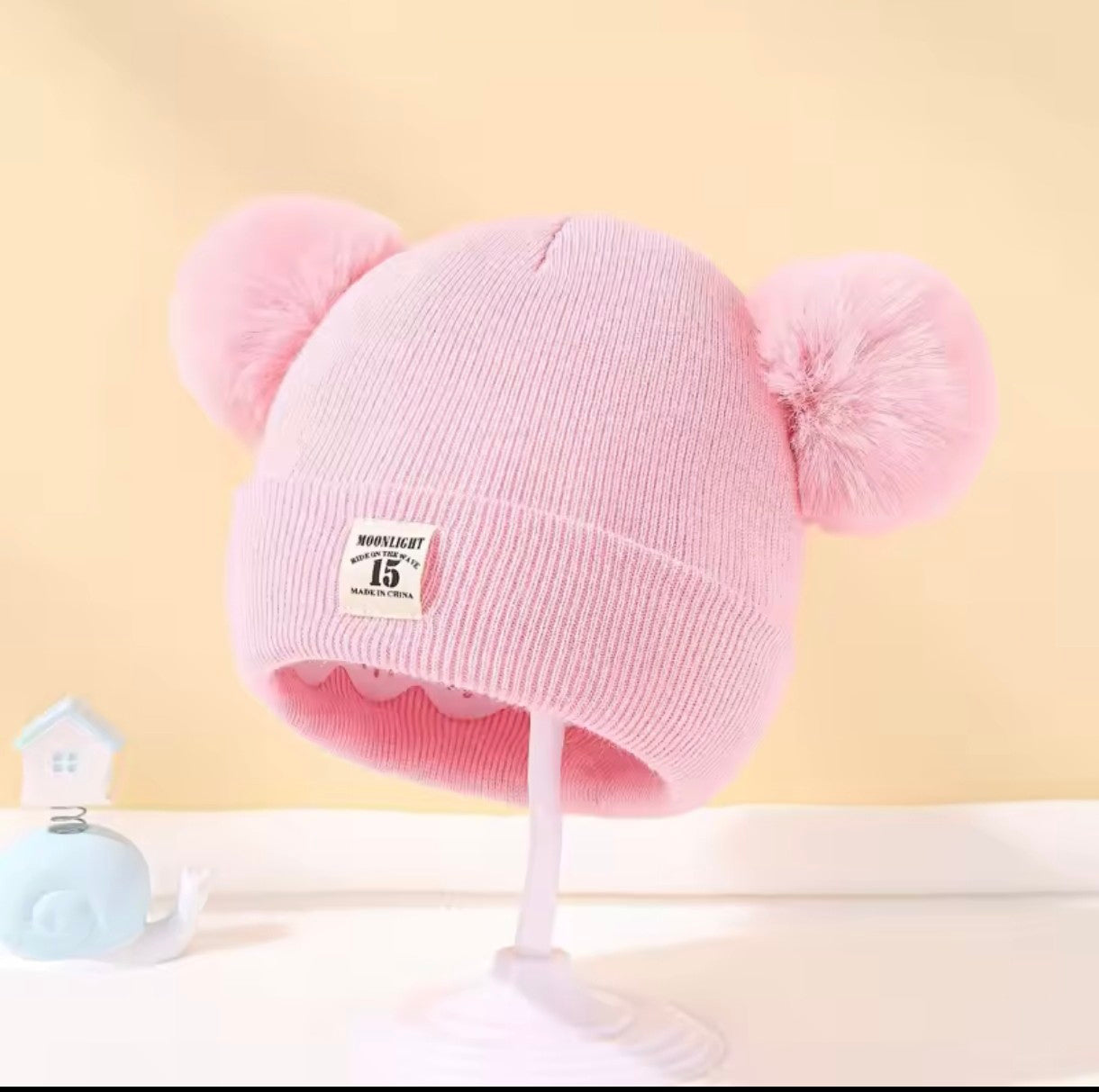 Gorro infantil com pompons